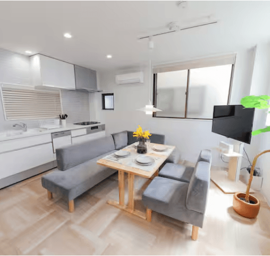 Modern living room and kitchen in Yurie's renovated Tokyo house