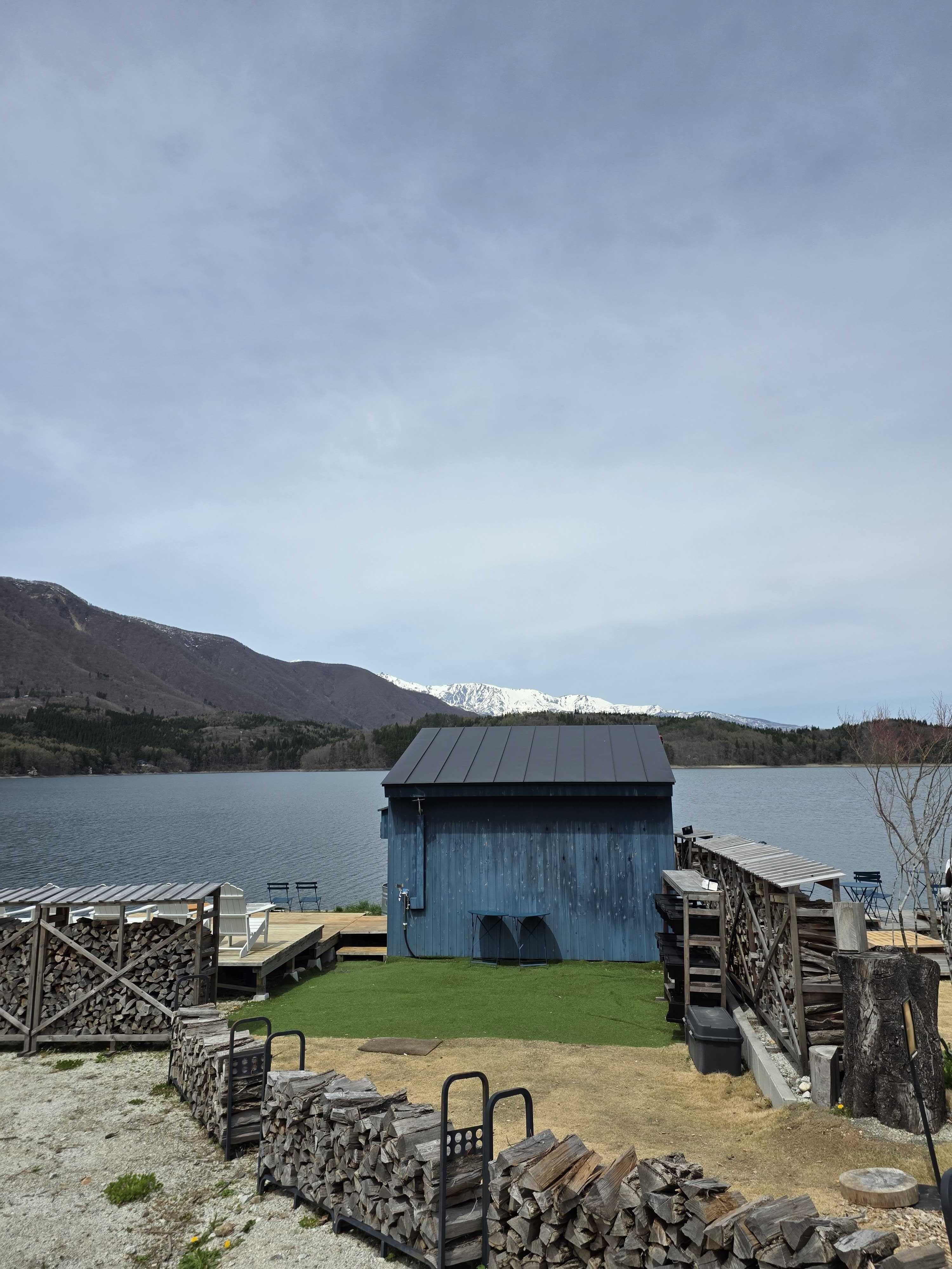 ao LAKESIDE CAFE exterior with Lake Aoki and Northern Alps in background